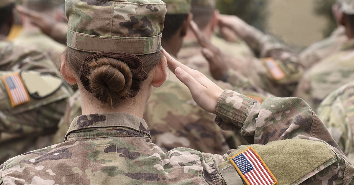 Woman in military uniform giving a salute